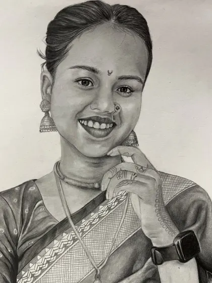 A finished pencil sketch of a smiling woman in a sari. I took care to render the details of her traditional attire, including the intricate henna on her hand.