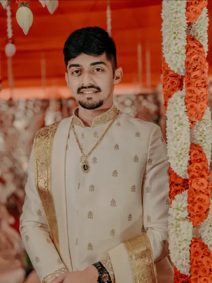 A portrait of the groom in his traditional Muhurtham attire, looking calm and ready for the ceremony.