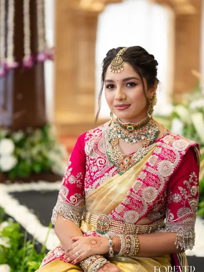 A close-up portrait of the bride's sister, showcasing her beautiful jewellery and the soft, glowing makeup look I created for her.