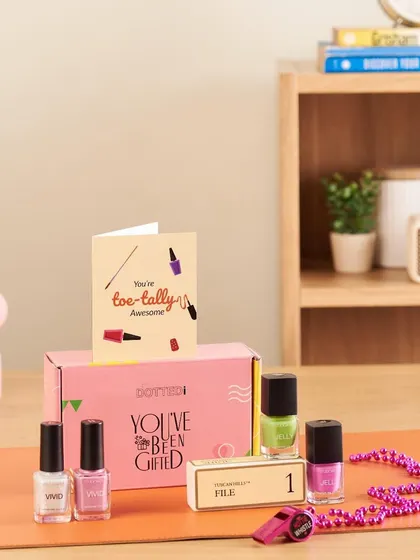 A fun and punny gift for a teacher, this "Toe-tally Awesome" pamper kit includes a set of colorful nail polishes, a nail file, and a greeting card.