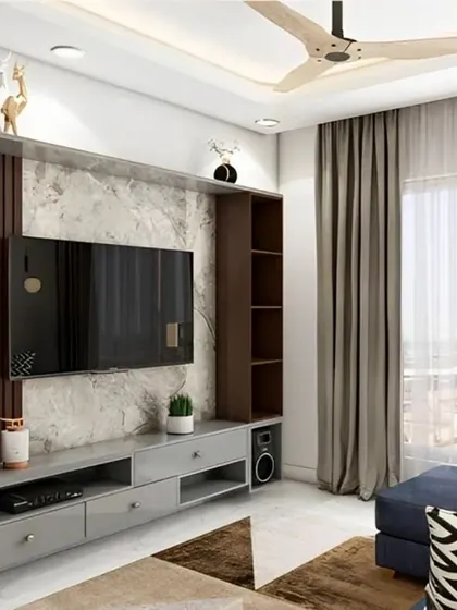 A functional TV unit with a mix of grey and wood-finish cabinets. The design includes open shelves for decor and dedicated space for a sound system, all set against a marble-textured back panel.