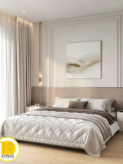 A bedroom with classic wall moulding and a neutral color palette, creating a timeless and elegant look.