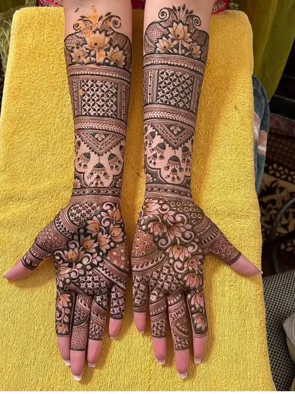 An elegant design with floral patterns on the palms and geometric check patterns on the arms, creating a beautiful contrast.
