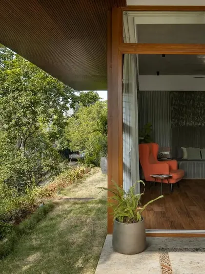 The view from the private terrace back into the bedroom, showing how the large sliding doors connect the two spaces.