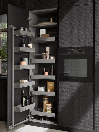 This tall pantry unit features individually adjustable shelves, allowing you to customize the storage to fit everything from tall bottles to small spice jars.
