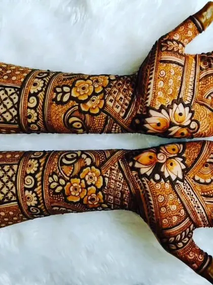A rich, dark-stained mehendi with floral bands and elephant motifs. This is the result of good paste and proper aftercare.