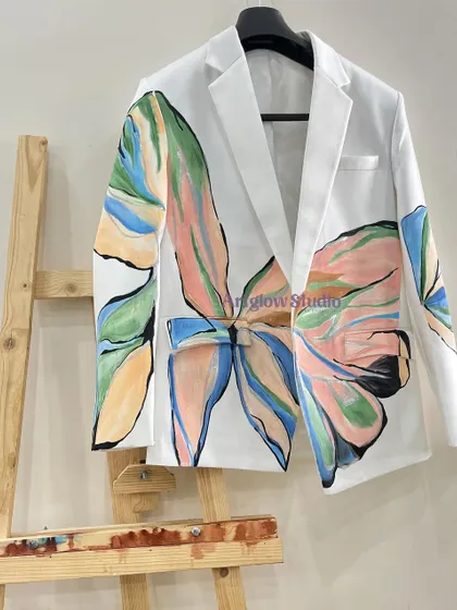 Another view of the pastel floral blazer, displayed on an easel like the piece of art it is. The oversized design makes a powerful fashion statement.