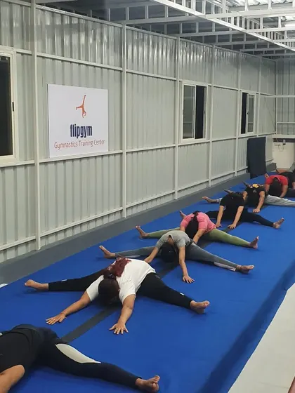 Working on straddle stretches is essential for skills like splits and certain tumbling passes. Our adult class focuses on these foundational flexibility drills.