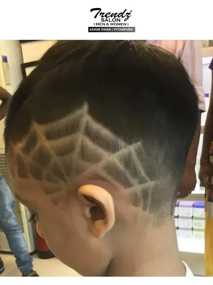 A cool spiderweb design for a young superhero fan. We love getting creative with our kids' cuts.