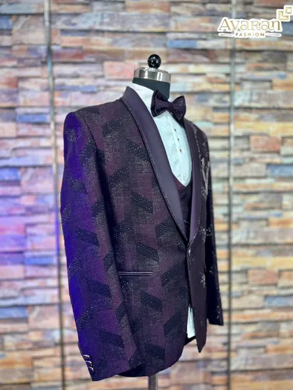 A side view of the wine-colored reception suit, showing how the light catches the shimmering geometric pattern on the jacket. It's a dynamic outfit that looks great from every angle.