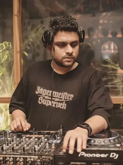 DJing at a private event in Goa. I'm experienced in providing the perfect musical backdrop for exclusive parties and gatherings.