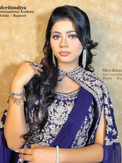 The full party look, where the soft, glamorous waves complement the heavily embroidered modern attire.