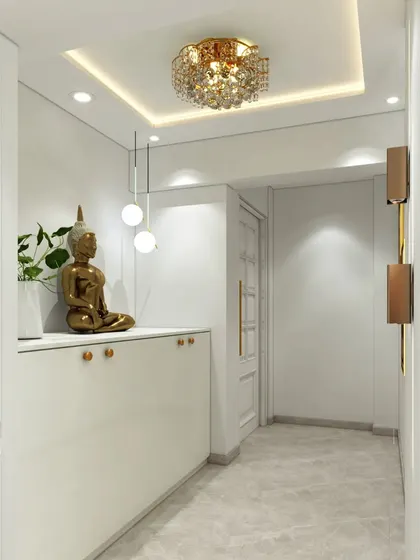 An all-white foyer that exudes serenity and elegance. The space features a floating console with a Buddha statue, a crystal chandelier, and classic wall moulding.