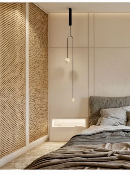 Here, I've used a combination of textures to create a serene and sophisticated bedroom. A woven cane wall panel adds a natural, earthy element, while the minimalist pendant light provides soft, ambient illumination. The built-in bedside niche is a functional detail that keeps the space clean and uncluttered.