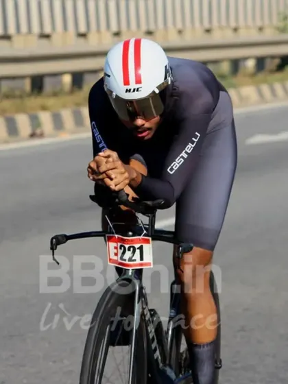 The race of truth. A rider in full aerodynamic form pushes against the clock during a Namma ITT (Individual Time Trial), a pure test of individual power and endurance.