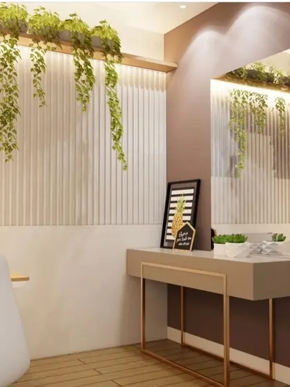 A simple yet chic dressing corner with a floating console table, a large mirror, and a feature wall with vertical grooves. The hanging plants add a refreshing touch of nature.