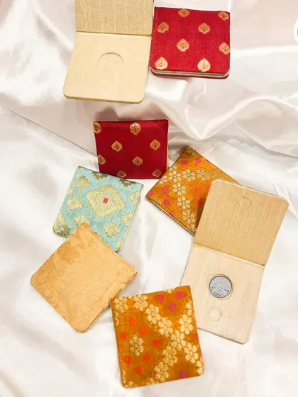 An assortment of our personalized coin boxes, showing how they can be customized to fit your wedding's aesthetic.