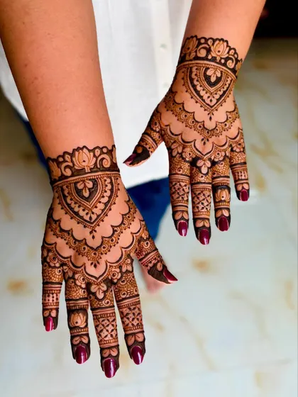 An angled view showcasing the rich color and detail of this Indian mehendi design.