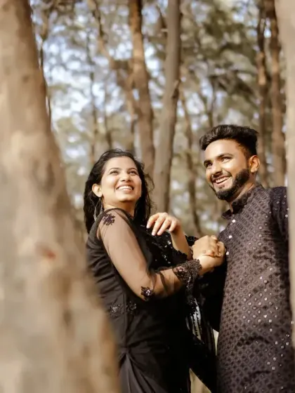 A candid moment of laughter and joy, framed by the trees of a forest. My goal is to capture the real smiles and connections that make your relationship unique.