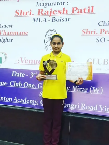 Aditi Yadav proudly displaying her runner-up trophy and certificate from the State Mini Championship.