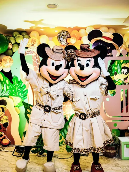 Mickey and Minnie Mouse mascots in their safari gear, ready to greet guests. Having characters at the party adds an element of magic and excitement for the children.