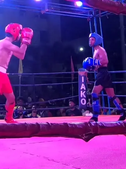 The fighters stand ready in the ring, a moment of calm before the storm.