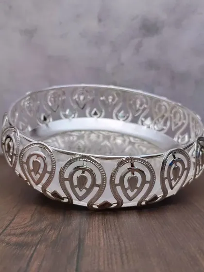 Another angle of the leaf designer tray, showing how the light catches the intricate cuts in the border.