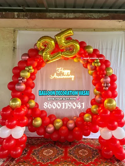 A vibrant red and gold balloon ring for a 25th-anniversary celebration. The "Happy Anniversary" neon sign and large foil "25" make it a festive and bold statement piece.