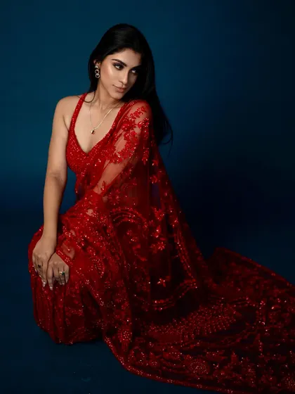 Lady in red. This look for Samyakk sarees is all about classic glamour, with a focus on flawless skin and beautifully defined eyes to complement the intricate red saree.