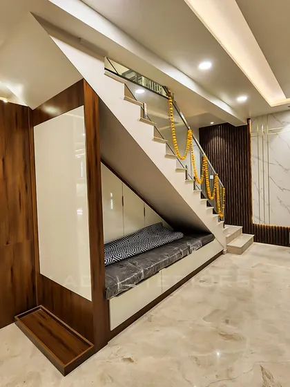 A clever use of space under the staircase, converted into a cozy seating nook with built-in storage. This design demonstrates my approach to maximizing functionality without compromising on style.