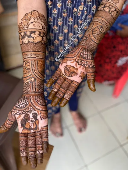 A sweet baby shower mehendi with a couple portrait and other baby-themed elements. It's a beautiful way to celebrate the parents-to-be.
