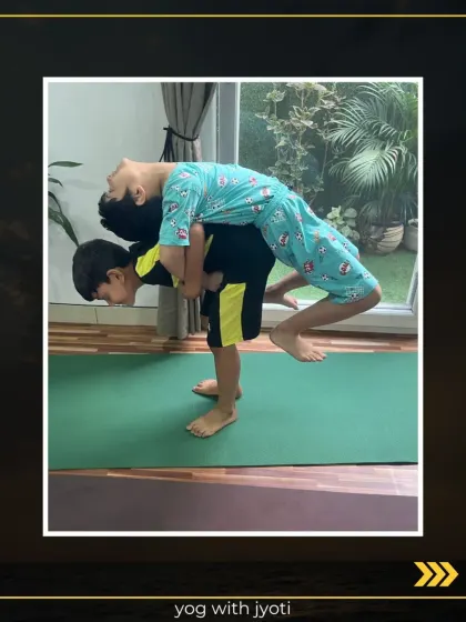 Two young boys working together in a partner backbend. This activity fosters teamwork and helps them develop physical confidence.