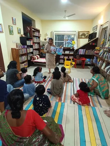 A full room view of a story session, showing the comfortable and casual atmosphere we cultivate.