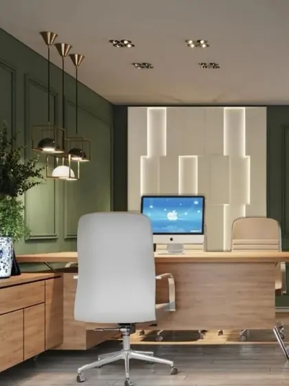 The executive workstation in a modern office, combining natural wood tones with a rich green accent wall. The design is clean and uncluttered, with stylish pendant lighting and a backlit feature wall adding a touch of sophistication.