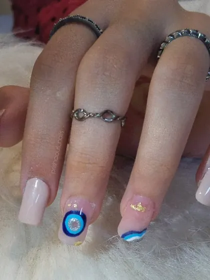 The full evil eye set on square-shaped extensions. The nude base makes the blue and gold details really pop.