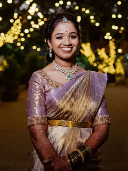 The perfect smile of a happy client for her reception. I created a soft, romantic look with an elegant hairstyle and subtle makeup that highlights her features, beautifully complementing her lavender and gold saree.