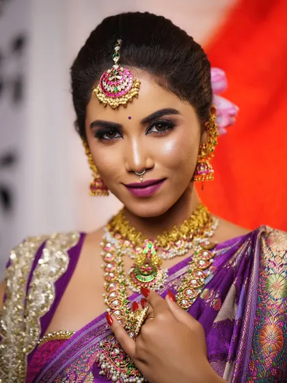 A direct, engaging portrait. The eyes are the focus, with makeup that makes them pop, while the rest of the face is kept fresh and glowing.