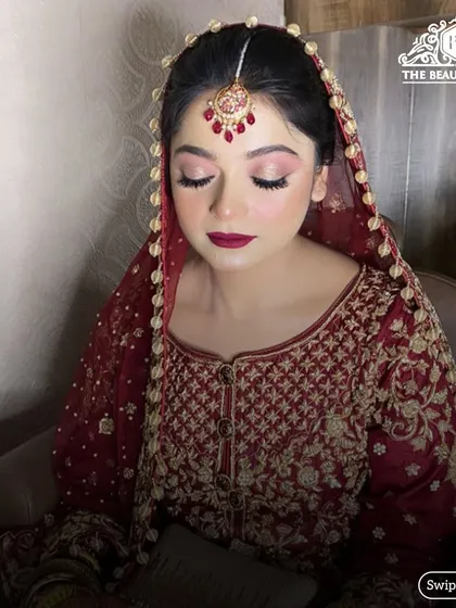 Another angle of this beautiful bridal makeup, highlighting the perfect contour and the way the light catches the shimmer on her eyelids.