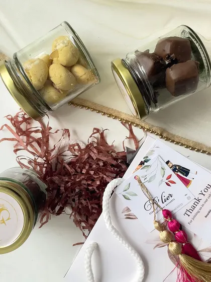 Adding a touch of sweetness to wedding celebrations. These return gift bags include jars of our gourmet treats and a custom thank you note from the couple.