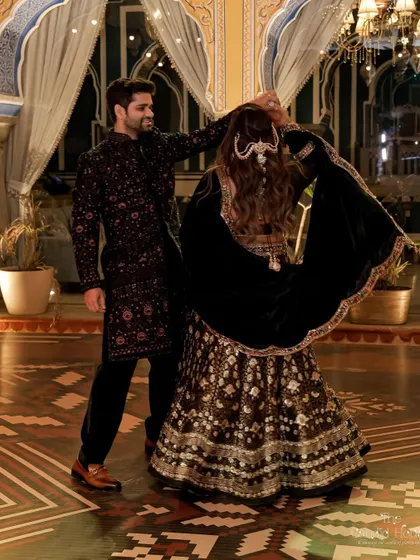 A playful moment on the dance floor, capturing the joy and elegance of the Retro Sufi sangeet night.