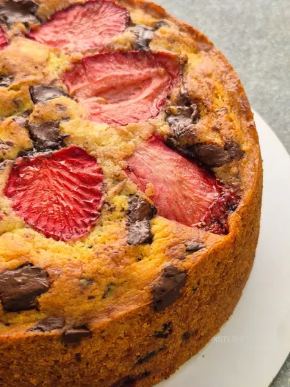 The rustic, golden-brown crust of the strawberry vanilla tea-time cake. It's a simple, comforting cake that's perfect with a cup of tea or coffee.