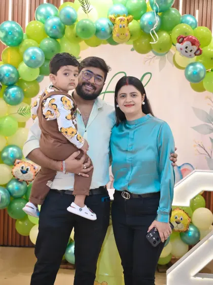 A family portrait with the birthday boy at his jungle-themed second birthday party.