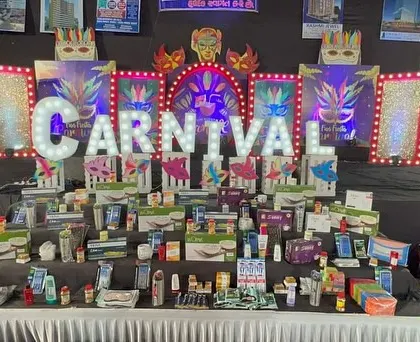 Another view of the carnival stage with the prize table fully stocked, ready for the event's activities and giveaways.