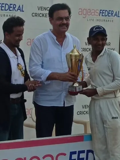 Jay Nadar receiving the Best Batsman award from cricket legend Dilip Vengsarkar.