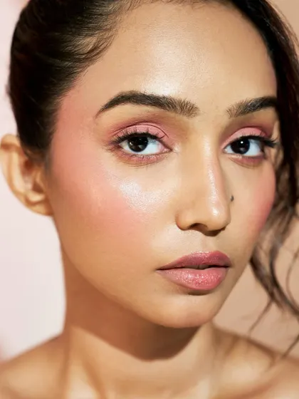 This portrait captures the essence of a fresh, modern beauty look with an emphasis on perfect skin.