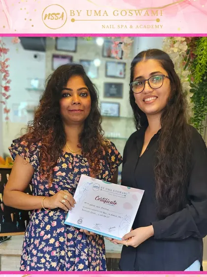 Harman proudly holding her certificate after completing her course. She is now ready to take her skills back to Delhi.