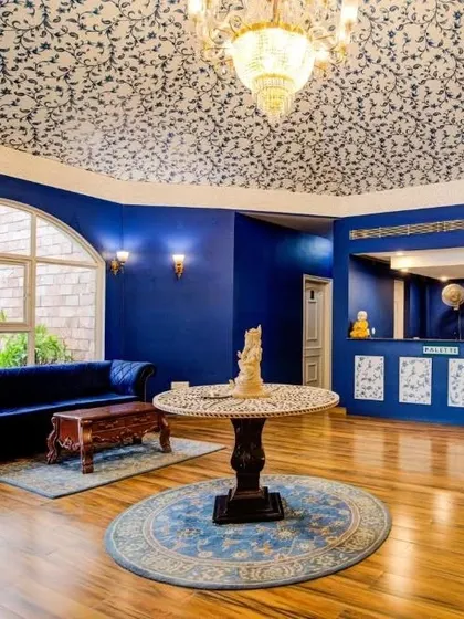 For the Hotel Tivoli, I designed this intricate ceiling wallpaper inspired by Mughal patterns. The design complements the royal blue walls and grand architecture, adding a layer of heritage and luxury to the reception area.