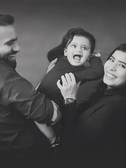 A candid moment of pure joy! I love capturing these playful, happy interactions during family photoshoots.