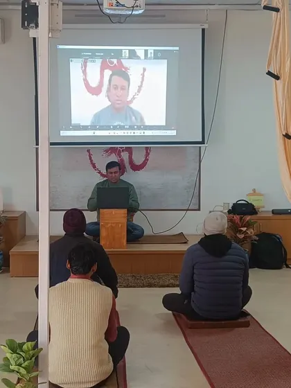 Here you can see one of our online participants projected for the class to see. This interactive setup in our workshops fosters a sense of community between our online and offline students.