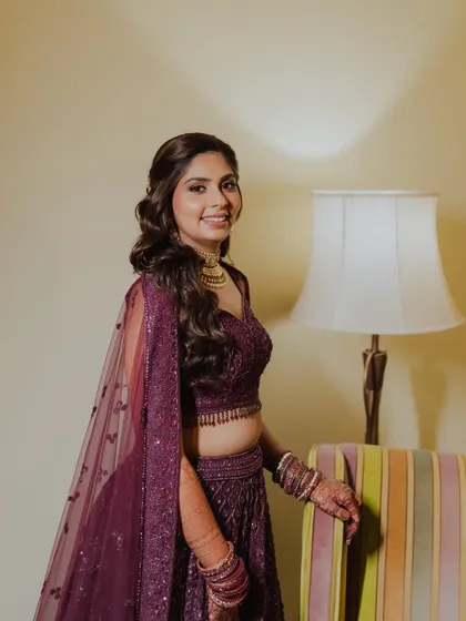 A happy, smiling portrait. The makeup is glamorous but still feels fresh and youthful.